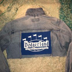 Wrangler brand cropped light-wash denim jacket customized with "LA" and "2024" patches and a sequin cherry graphic