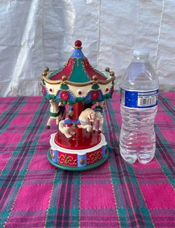 Avon Christmas Musical Carousel Santa and Horses.