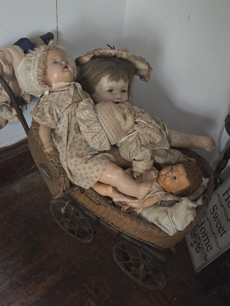 Antique Baby Carriage And Dolls