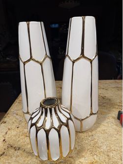 TWO SETS OF VASES