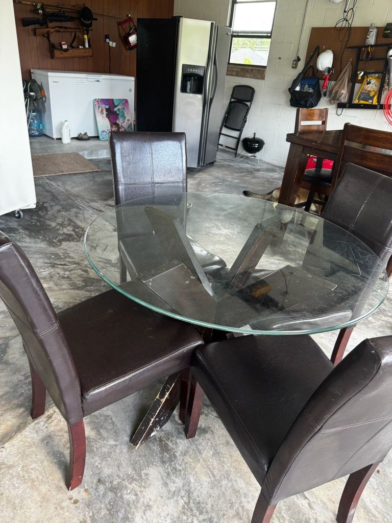 Round, glass-top dining Table + Chairs