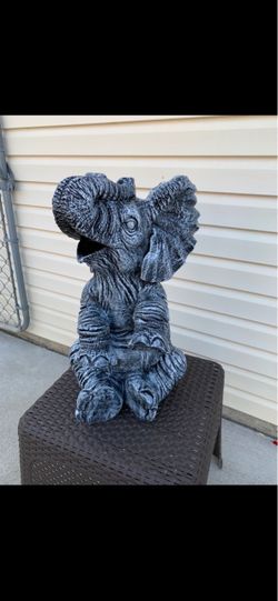Large, happy elephant statue