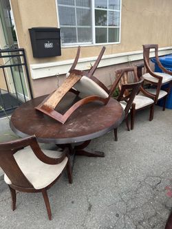 Round dining table with 6 chairs