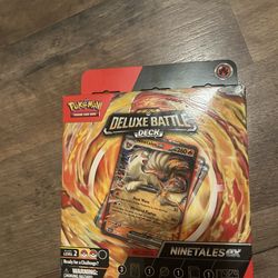 2 Pokemon cards with game board