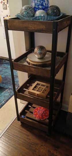 Wooden 4 tiered rolling cart.
