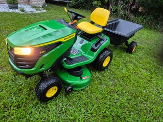 JOHN DEERE S130 22HP 42"CUT WITH PULL BEHIND DUMP TRAILER