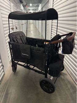 WonderFold W4 Elite 4-Seat Stroller Wagon + Floor Mats + Accessories – Excellent Condition