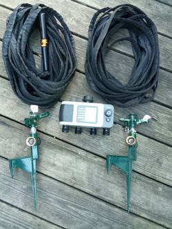 2 100ft hoses 2 sprinklers 1 four-way digital timer