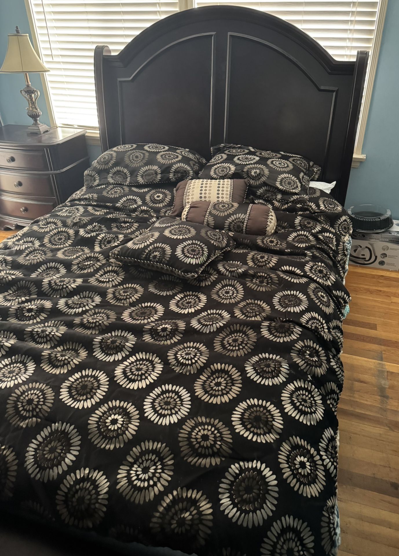 bed and mattress and side table