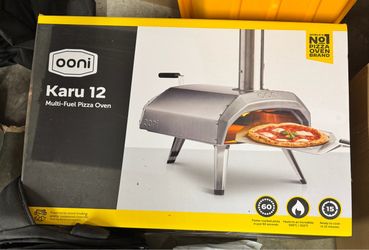 Brand new Ooni Karu 12 Multi-Fuel Pizza Oven + Ooni 12” Perforated Pizza Peel.