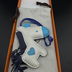 Authentic Hermès Rodeo Horse bag charm in multi-color design with blue heart.