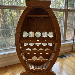 Vintage rustic oak barrel oval-shaped wooden wine rack. 16 bottles.