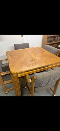 Dinning table with rolling chairs