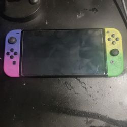 Nintendo switch oled with 2 controllers and marseille mclassic and 5 games 