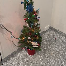 Christmas Tree With Lights, Toys, And A Bunch Of Other Stuff