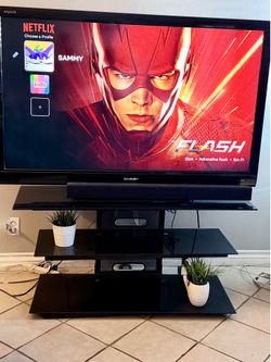 55” Sharp TV with stand and sound bar