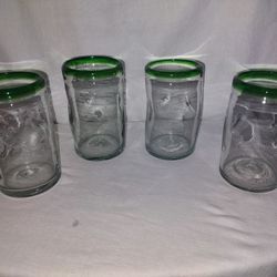 4 Recycled Clear Drinking Glasses With A Green Rim Edge On Top