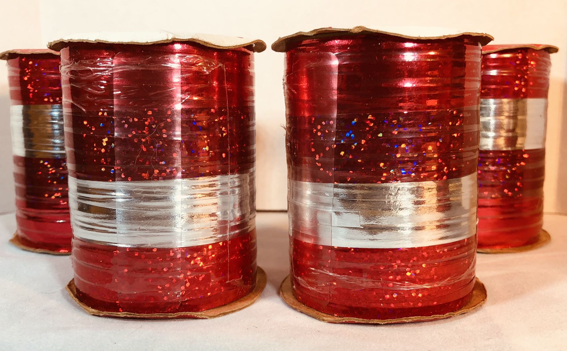 Bulk Ribbon (for Christmas Gift Wrapping). Four 70’ Rolls. Each roll has 4 color-types that are 17 1/2’ long and 3/16” wide for a total of 280 TOTAL