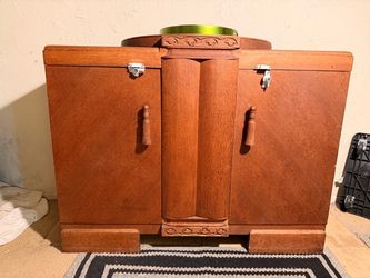 This Art Deco Oak sideboard buffet with Stunning Details and 2 drawers 3 shelves and a silverware compartment draped in black velvet. GORG