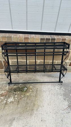 Iron frame over the sink storage unit