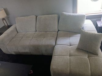 Grey in colour couch