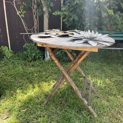 Garden Table With Metal Wall Hangings 