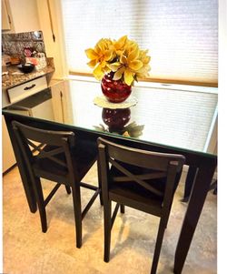 Black high top kitchen table and two chairs