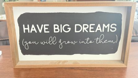 Have big dreams you will grow into them sign
