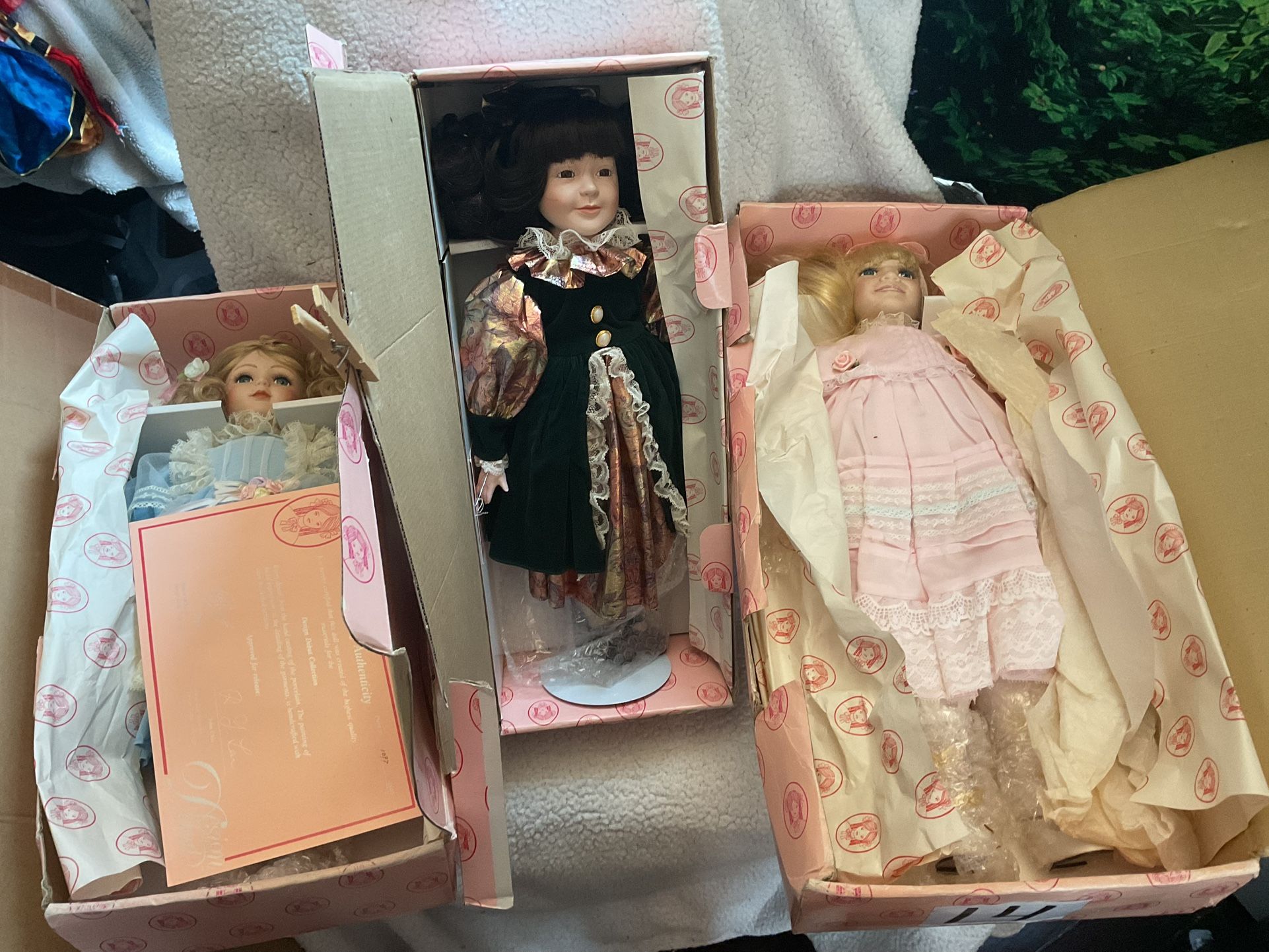 Three Design Debut Porcelain Dolls