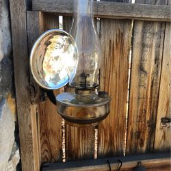 Vintage oil lamp with a with light reflector