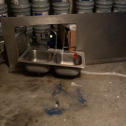 Un Sink La Plataforma De Acero Inoxidable