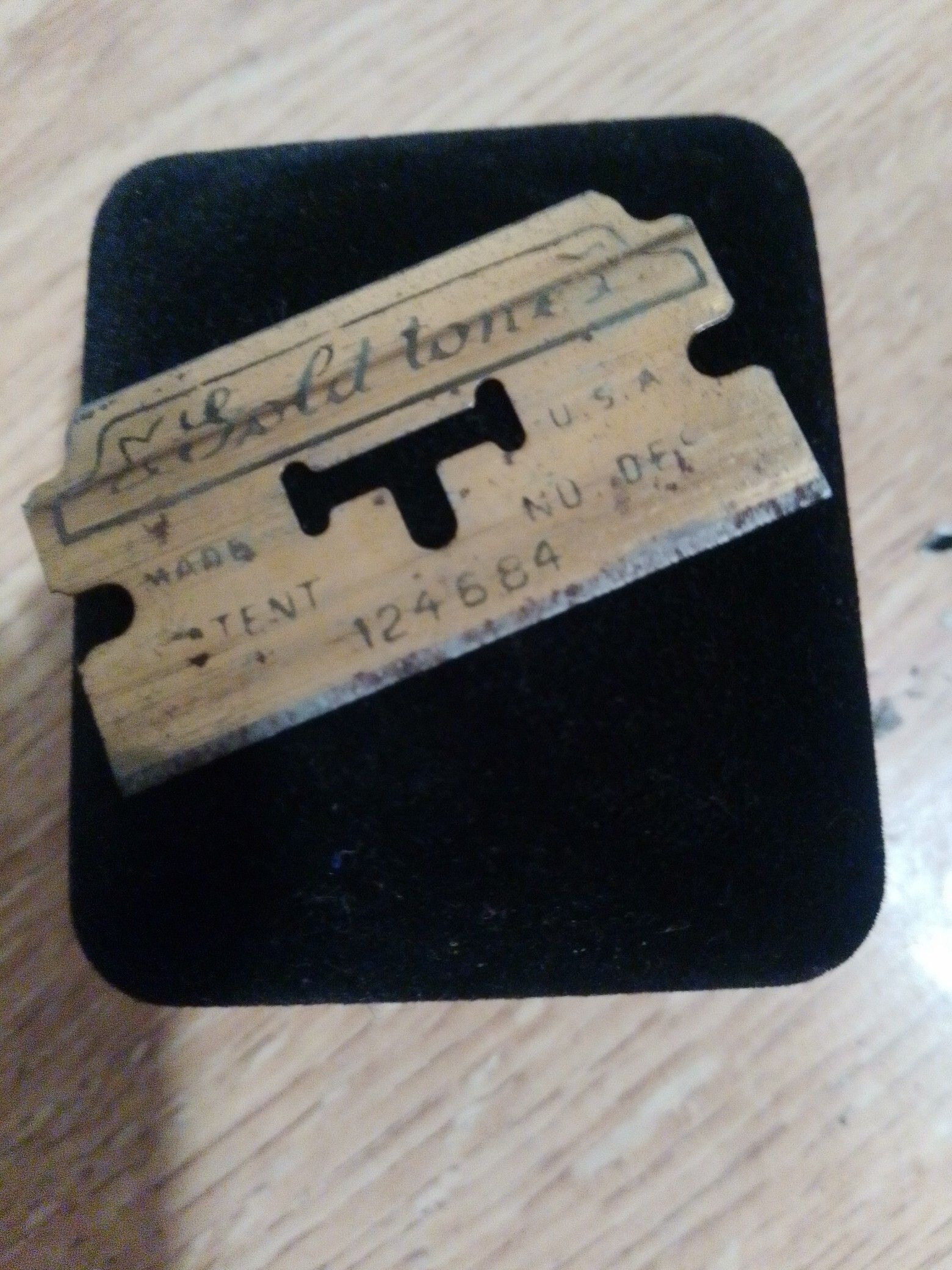 Vintage gold tone brand razor blade