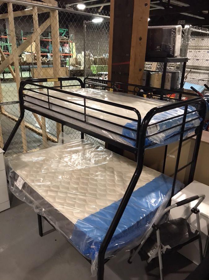 New twin over full bunk beds with new mattresses included