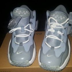 Grey and white nike zooms