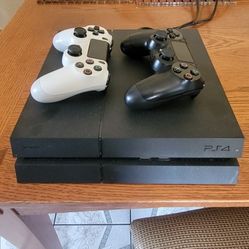PS4 Console Bundle – 2 Controllers + 8 Games – Good Condition