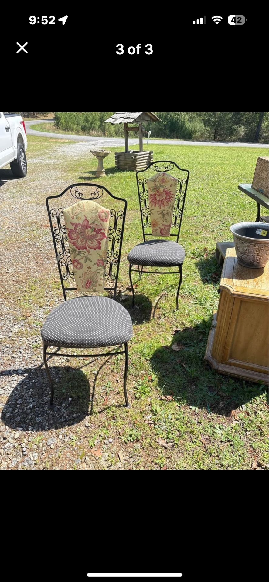 Two iron chairs sturdy could use some new fabric