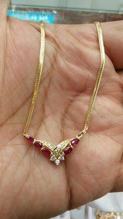 14k gold 5.4 grams chain & charm ruby & diamonds