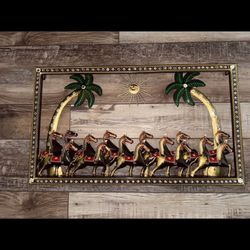Metal horse wall art with palm trees and sun