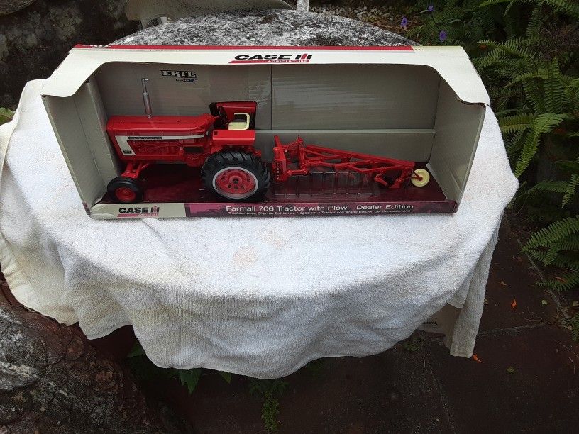 Farmall 706 Tractor With plow Dealer Edition. Made By Ertl. 