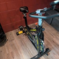 PYHIGH Magnetic Stationary Exercise Bike for Home Indoor Cycling Bikes Excersize Bike Comfortable Seat Cushion Belt Drive Ipad Holder with LCD Monitor