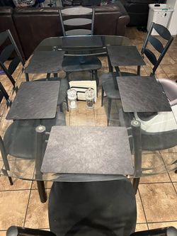 Glass top table and six chairs