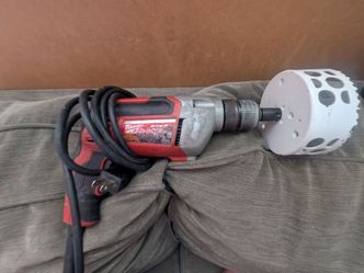 Milwaukee Corded Drill with Large Hole Saw Attachment