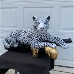 Snow Leopard On The Log Statue