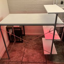 White computer desk with lights and remote