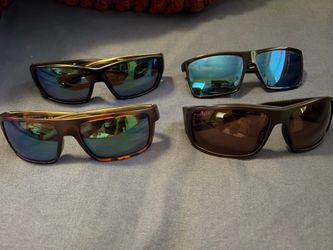 Four pairs of costa sunglasses