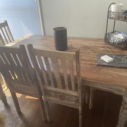 Rectangle Table And It’s Four Chair In Fair Condition 