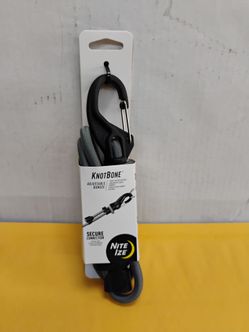 Nite Ize KnotBone Adjustable Bungee featuring a durable grey cord and plastic locking carabiner ends that let you adjust and secure the length without