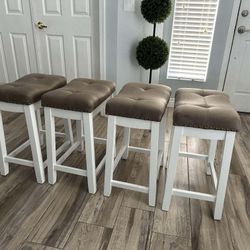 Four Matching Saddle Stools 