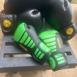 2 Pair Of Boxing Gloves 1 Larger Than The Other 