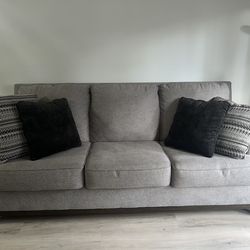 Like New Modern Greg/Brown Ashleys Sofa With 4 Plush Pillows